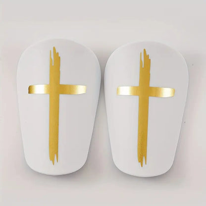 MIni shin pads with God's Cross